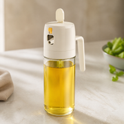 Noruva 2-in-1 glass oil sprayer on a light kitchen counter